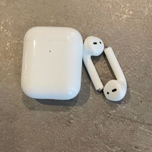Two left ear and charging station apple earbuds